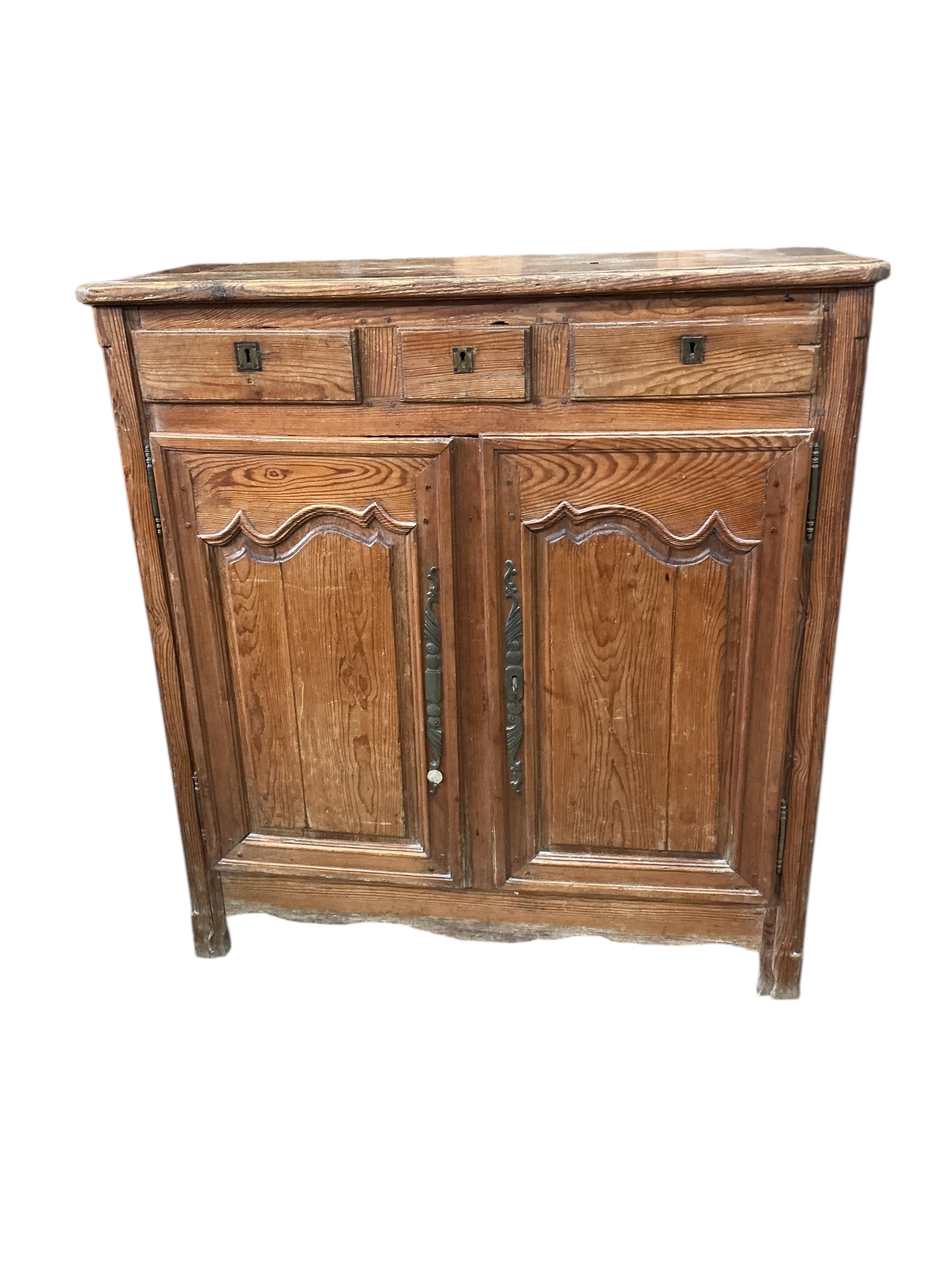 An early 19th century French pitch pine side cabinet, width 109cm, depth 48cm, height 115cm